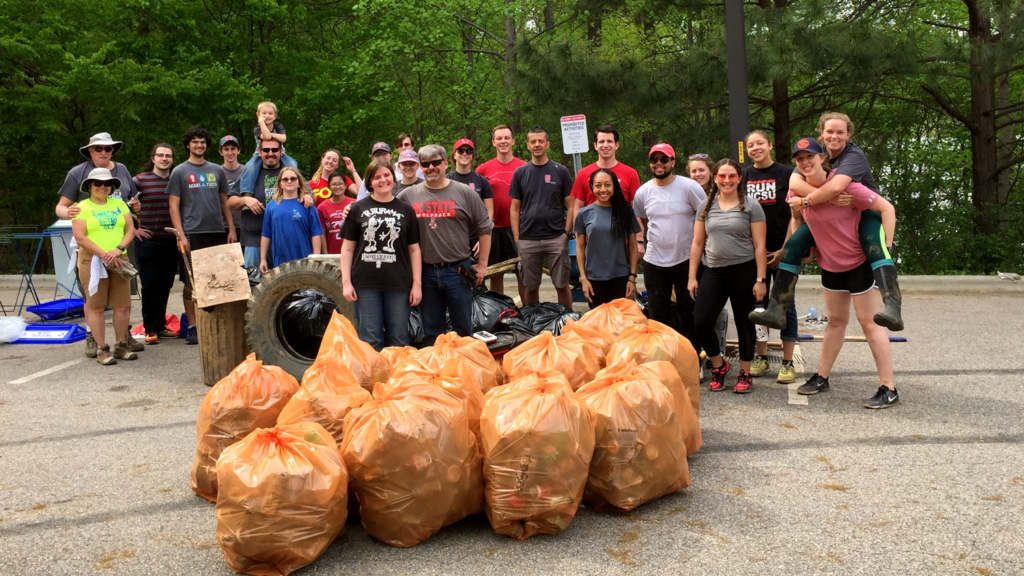 Group of students cleaning up the Lake Raleigh Woods trails