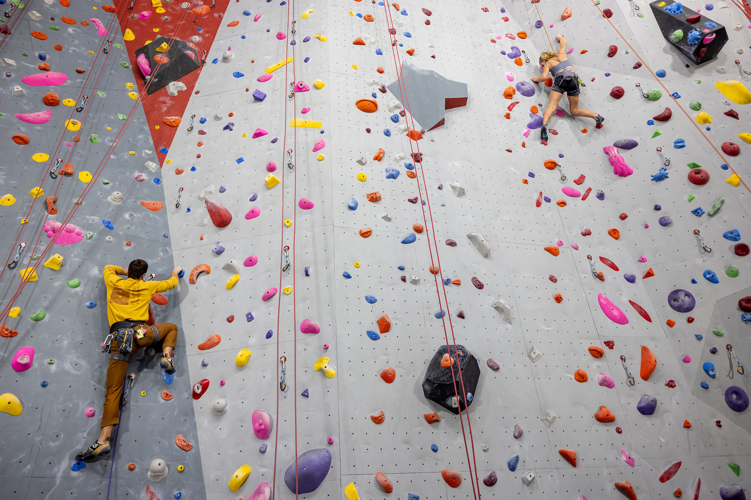 students climbing on the Climbing Center wall