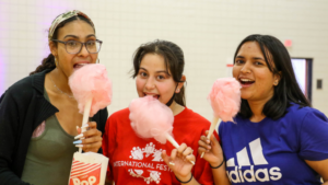 students eating cotton candy at a howl and chill event