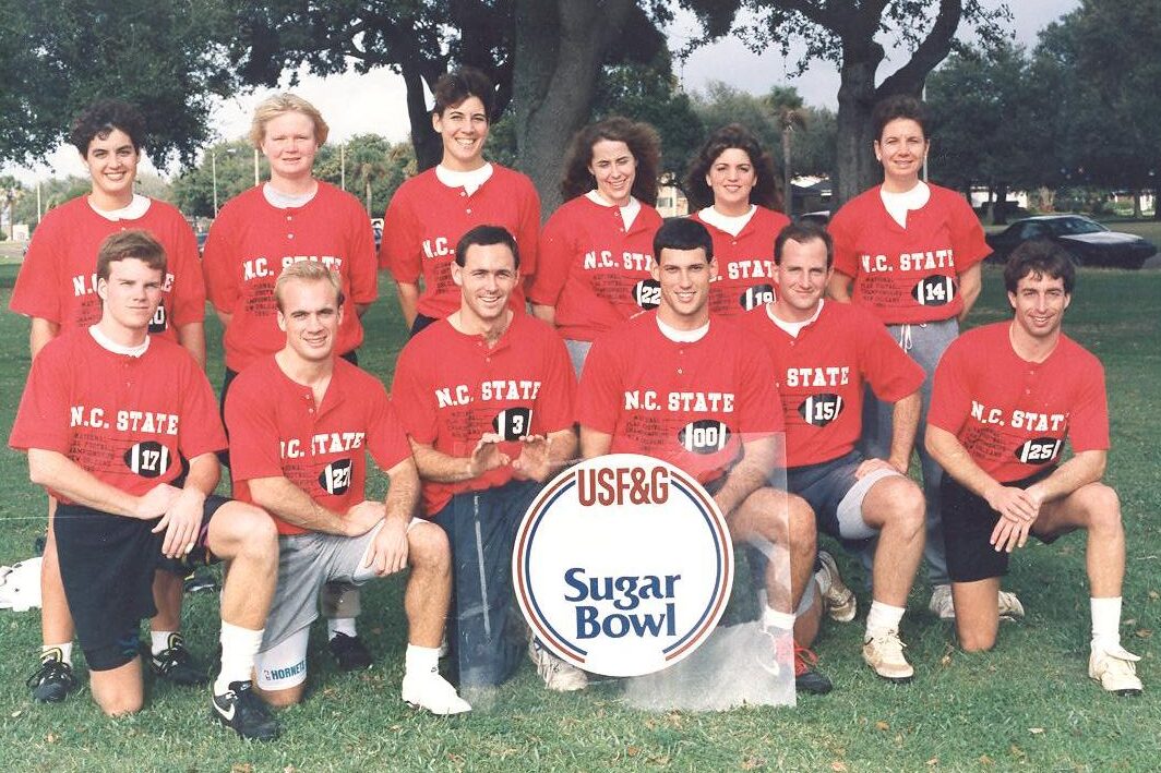 1990 Co-Rec Nation Flag Football Champions "Pack Attack" - (Back Row Left to Right): Gerri Robuck, Judy Lewis, Michelle Magill, Jenny JOnes, Christa Arboit, Jule Hanson
(Front Row Left to Right): John Fox, JT Grimes, Doug Herakovich, Michael Doyle, Chuck Wakeford, Randy Bechtolt