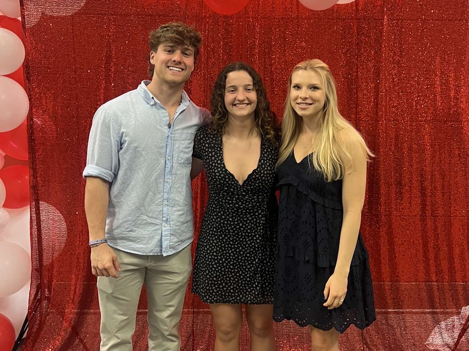 Michael McDermott and two other student employees posing at the Wolfie Awards Ceremony