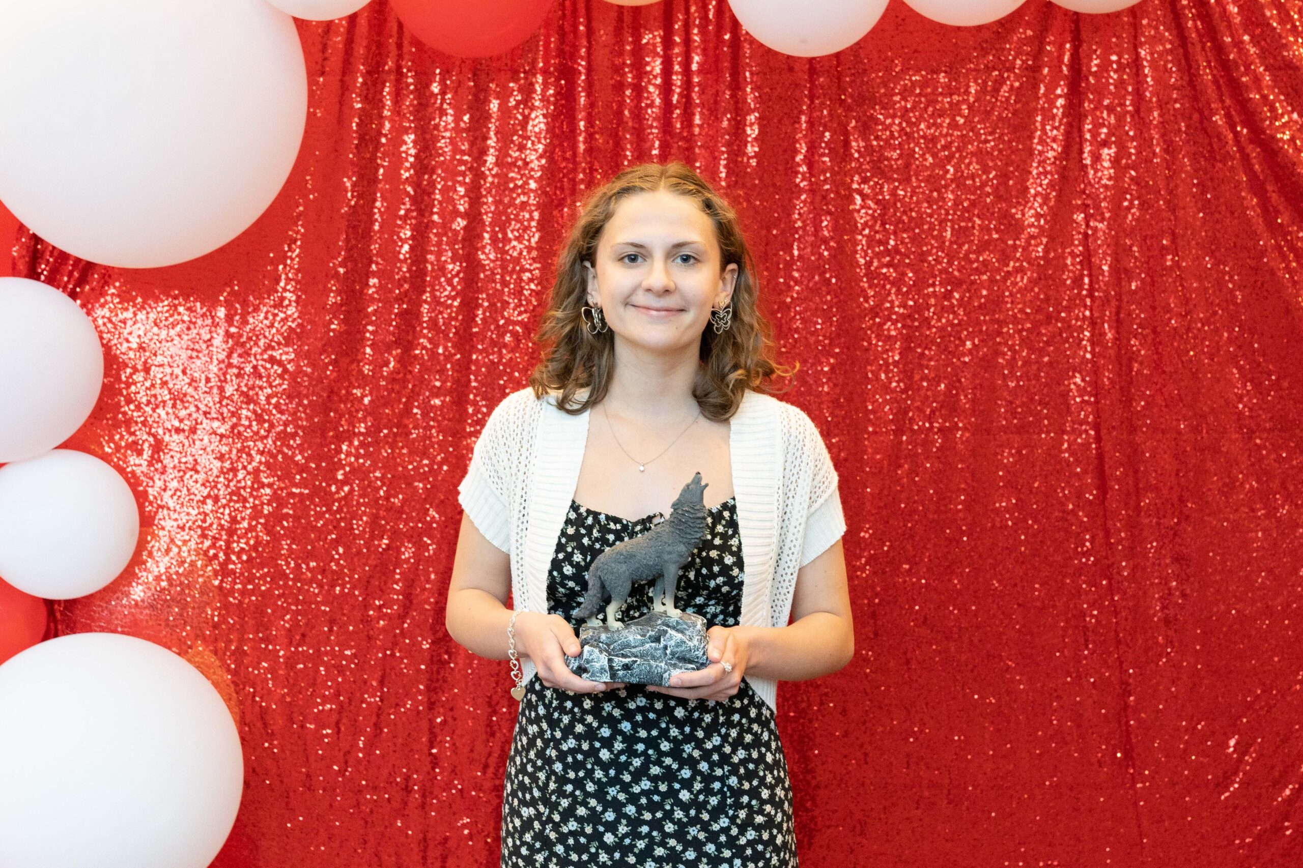 Lily Palmer Holding the Wellness Coach of the Year Award