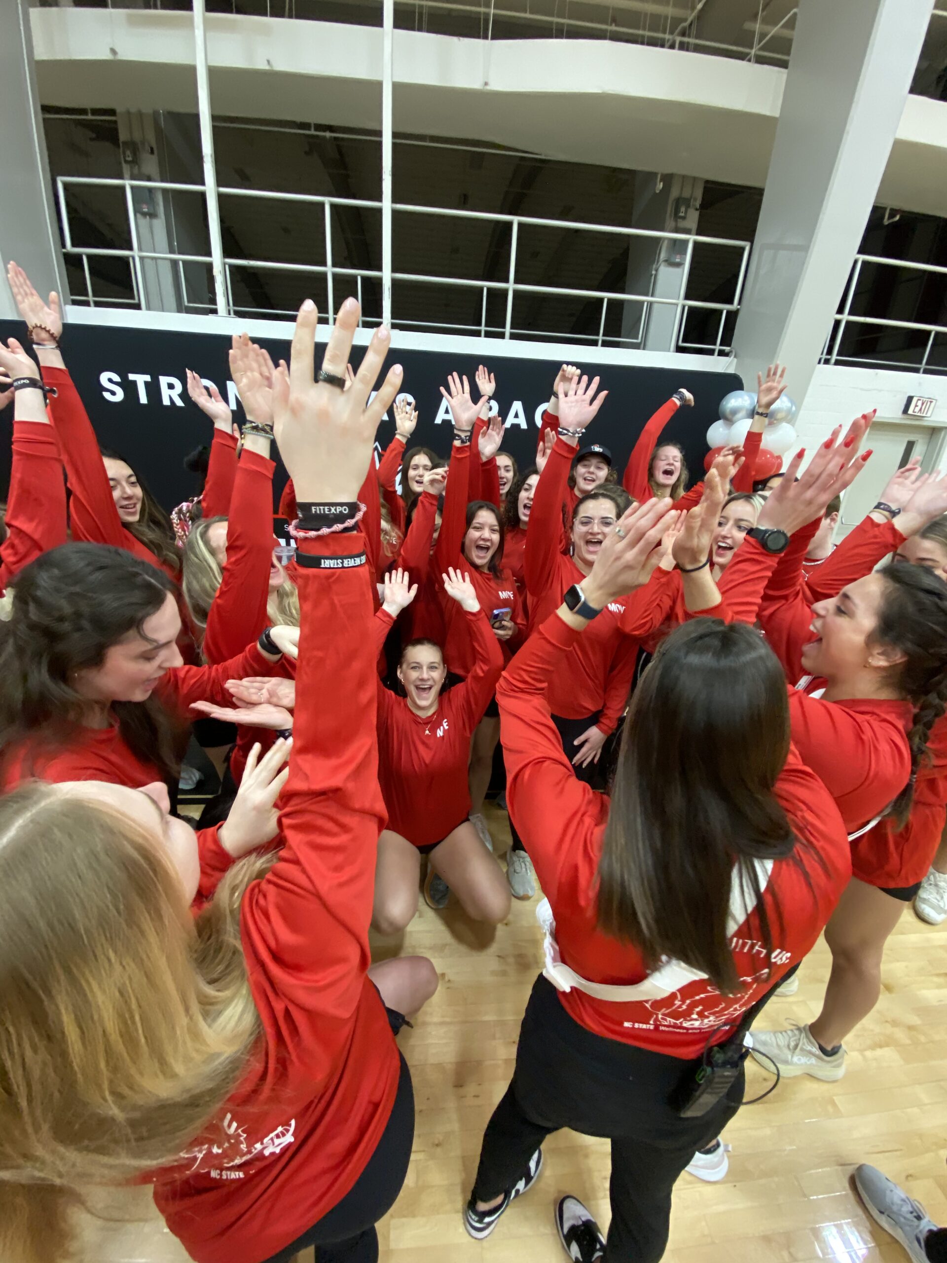 Wellness and recreation staff group high five